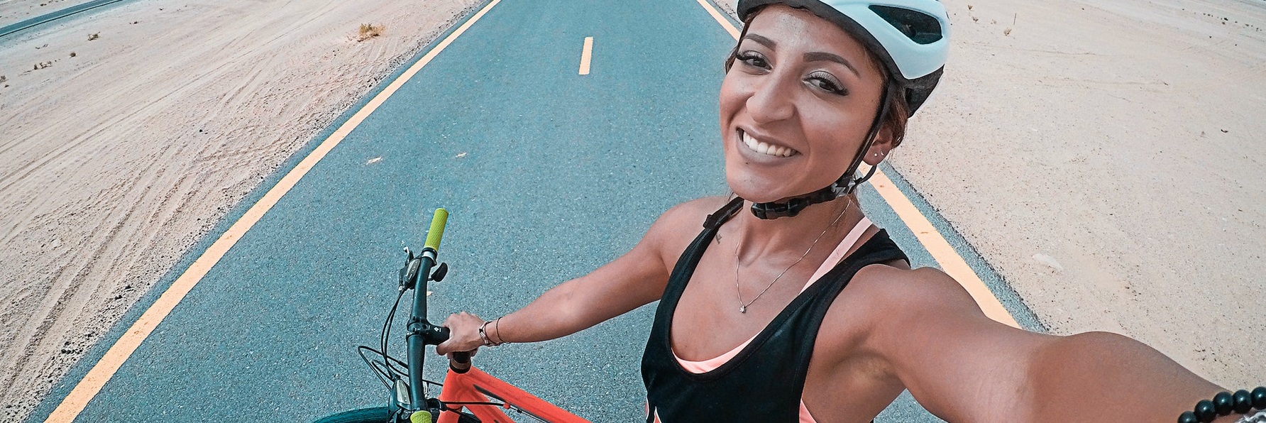 female biker taking selfie